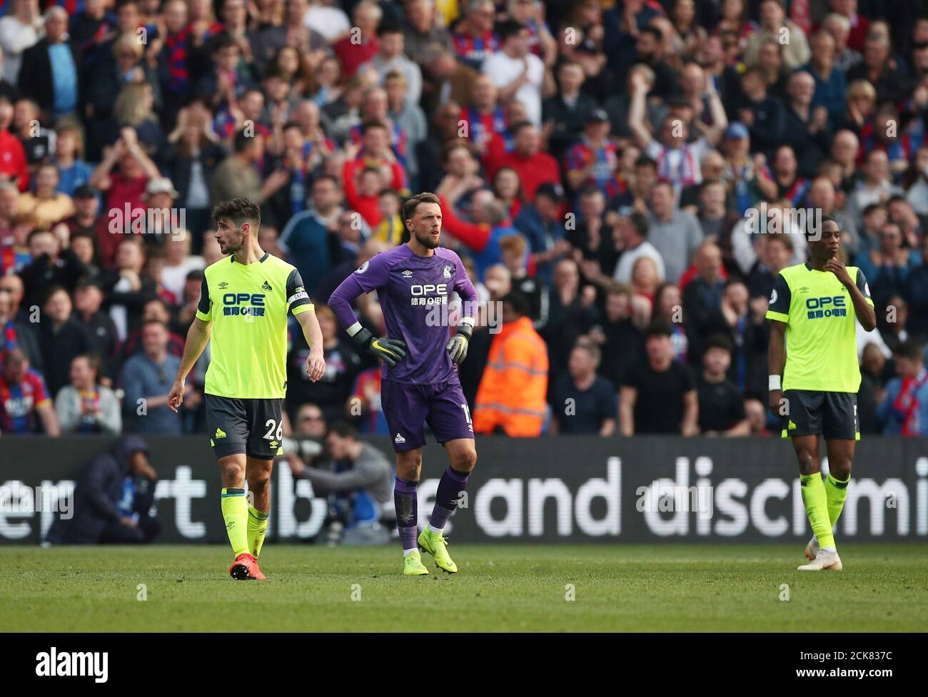 Soccer Football - Premier League - Crystal Palace v Huddersfield Town - Selhurst Park, London, Britain - March 30, 2019  Huddersfield Town's Ben Hamer and team mates look dejected after Crystal Palace's Luka Milivojevic scores their first goal      REUTERS/Hannah McKay  EDITORIAL USE ONLY. No use with unauthorized audio, video, data, fixture lists, club/league logos or 'live' services. Online in-match use limited to 75 images, no video emulation. No use in betting, games or single club/league/player publications.  Please contact your account representative for further details. Stock Photo