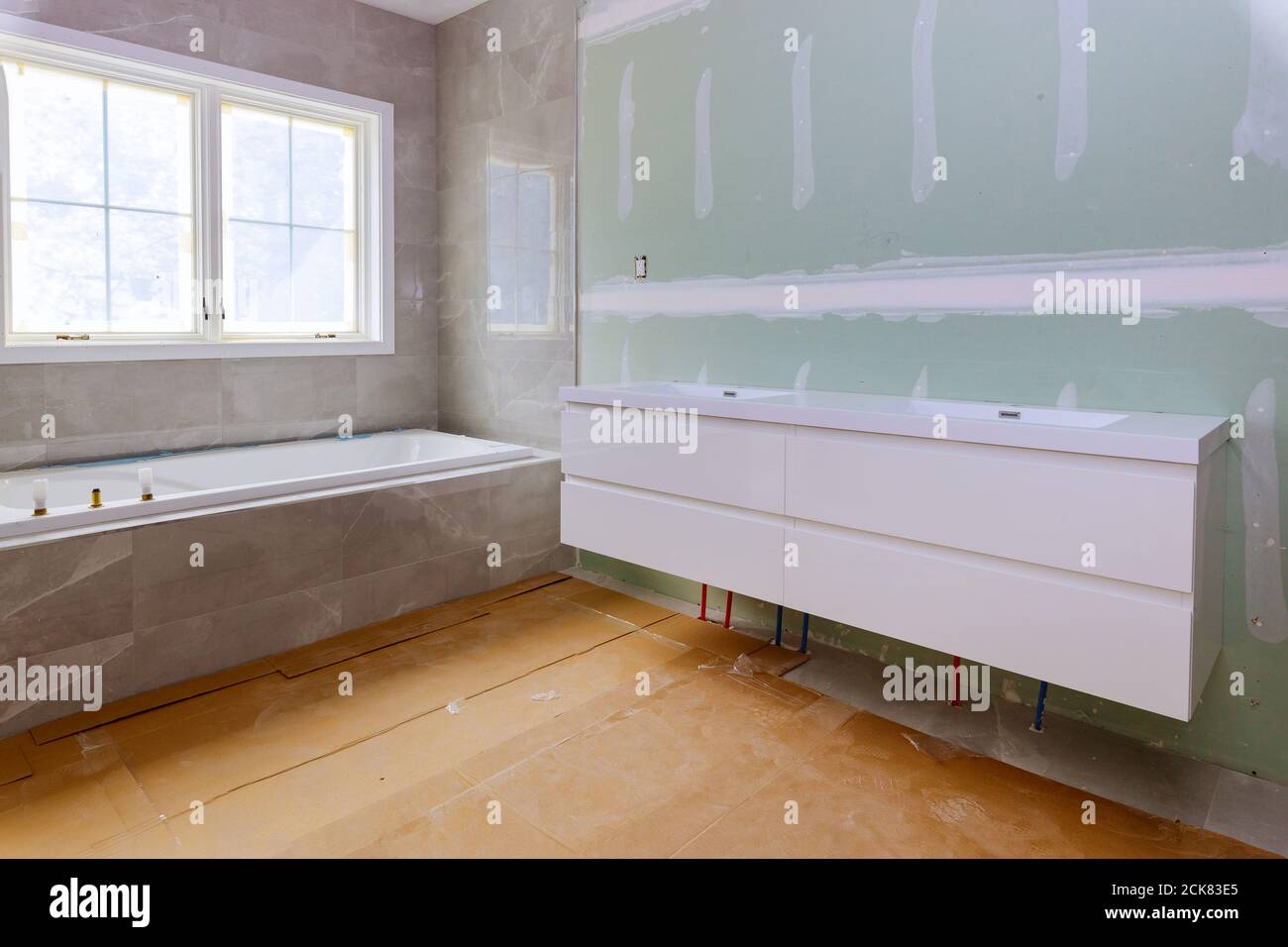 Home construction bathtub walls tiled after installing remodeling