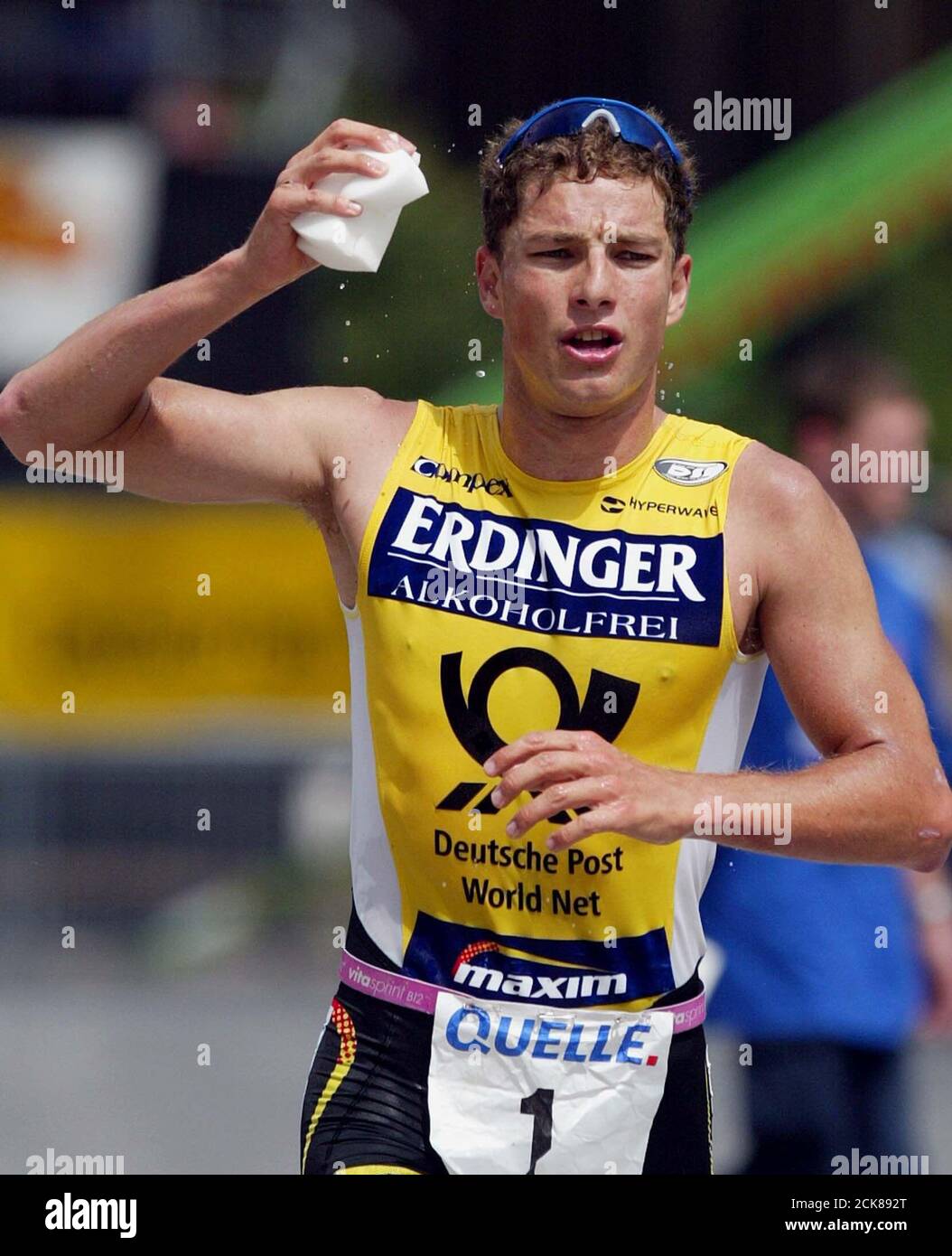 German triathlete Lothar Leder runs during the 42 km competition at the  Challenge triathlon in Roth, near Nuremberg, July 14, 2002. REUTERS/Michael  Dalder MAD Stock Photo - Alamy