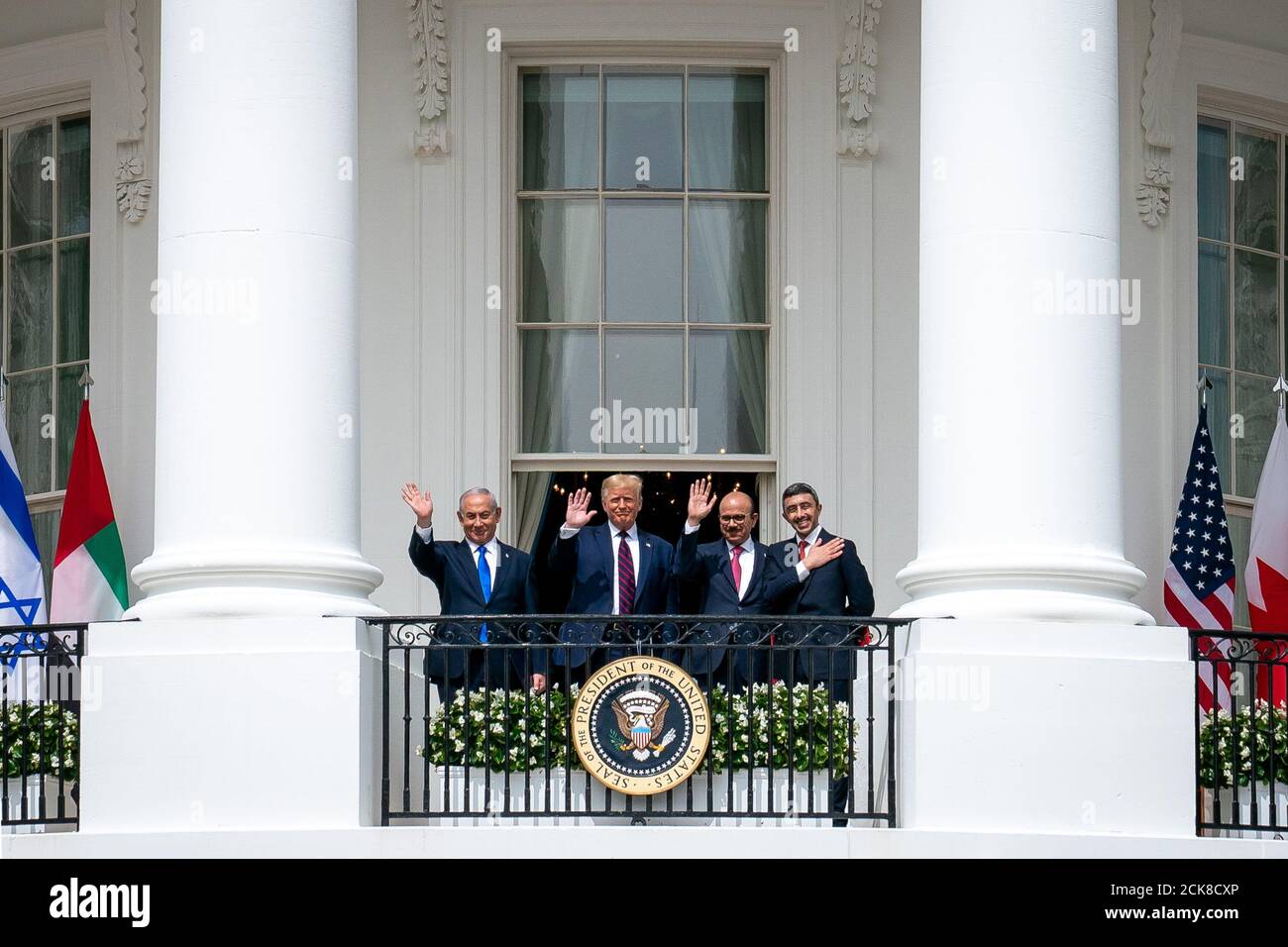 President Donald J. Trump, Minister of Foreign Affairs of Bahrain Dr. Abdullatif bin Rashid Al-Zayani, Israeli Prime Minister Benjamin Netanyahu and Minister of Foreign Affairs for the United Arab Emirates Abdullah bin Zayed Al Nahyanisigns wave from the Blue Room balcony during the Abraham Accords signing Tuesday, September 15, 2020, at the White House. (USA) Stock Photo