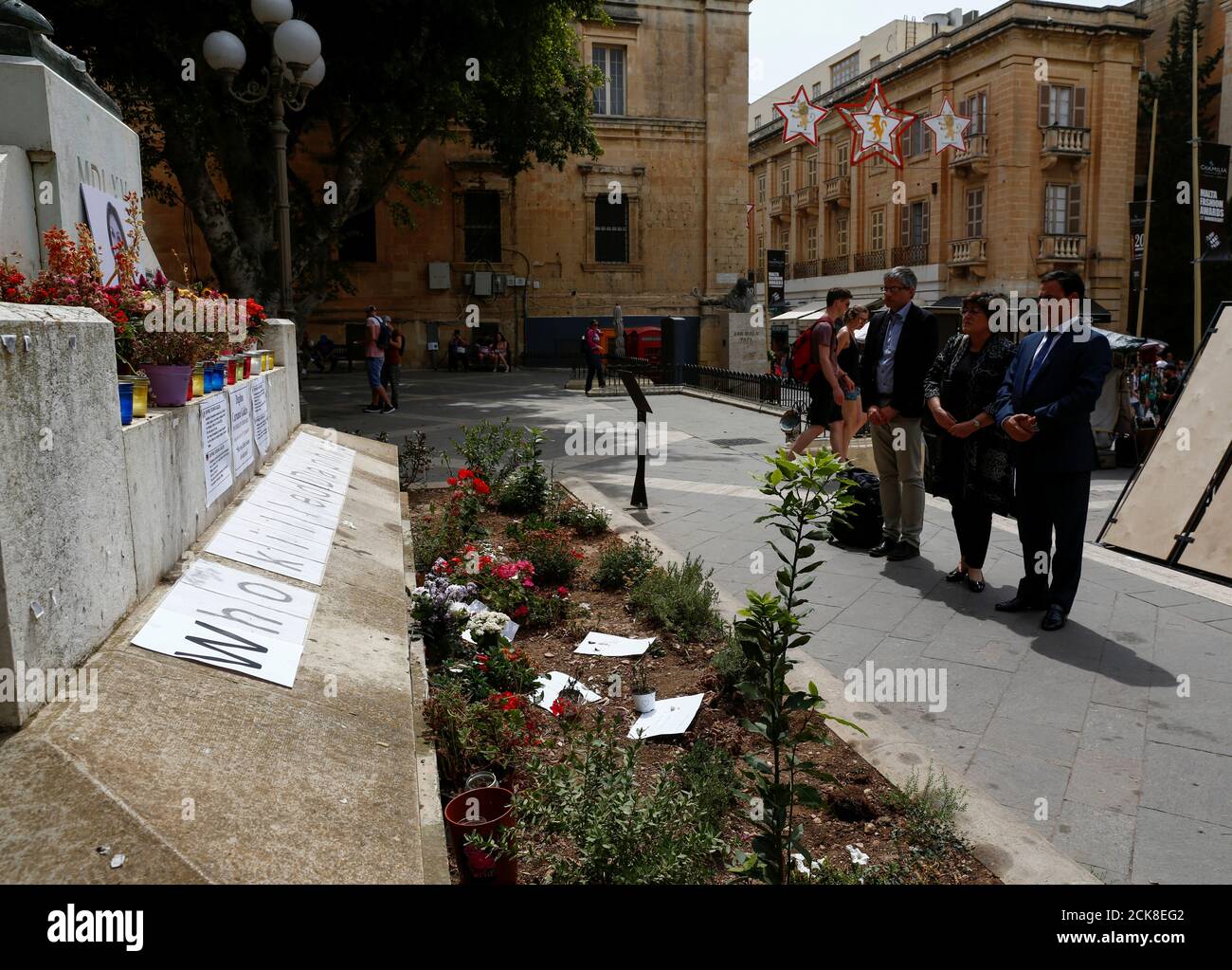 Sven Giegold, Ana Maria Gomes and David Casa, members of the ad-hoc mission  of the European Parliament to Malta, pay their respects at the makeshift  memorial to assassinated anti-corruption journalist Daphne Caruana