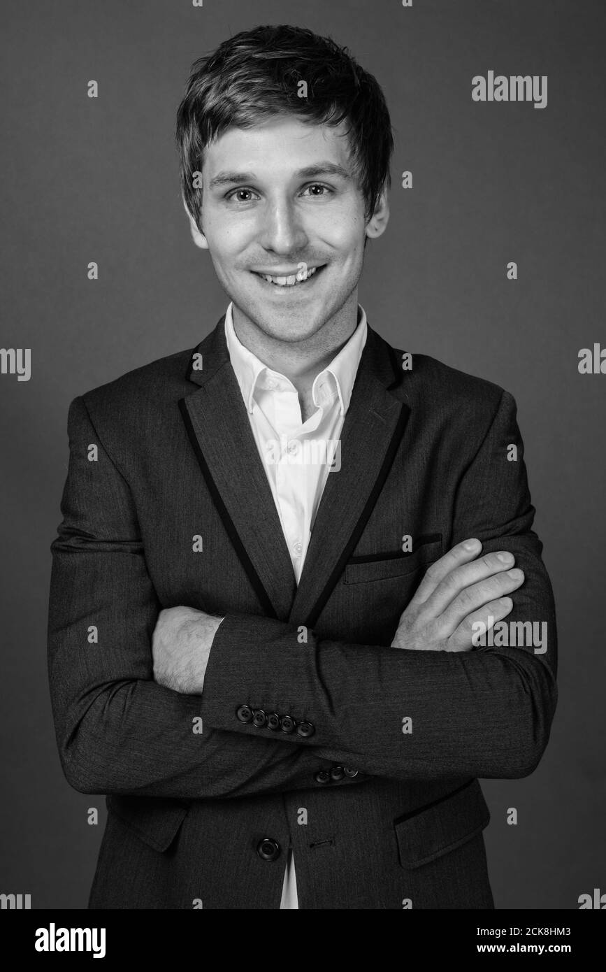Portrait of young handsome businessman wearing suit Stock Photo - Alamy