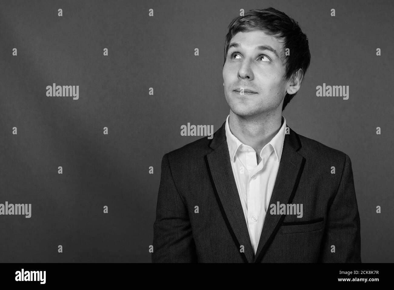 Portrait of young handsome businessman wearing suit Stock Photo - Alamy