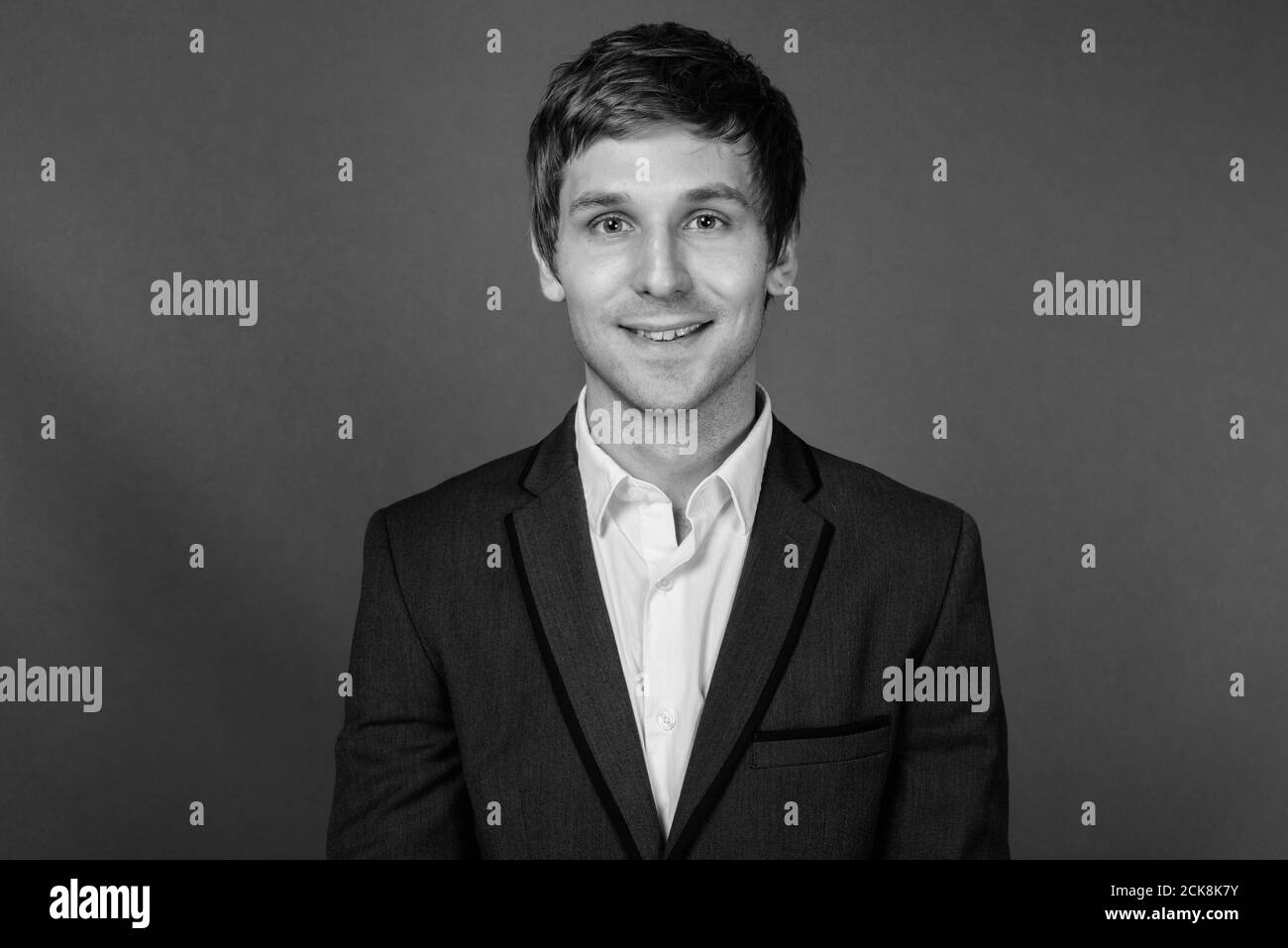 Portrait of young handsome businessman wearing suit Stock Photo - Alamy