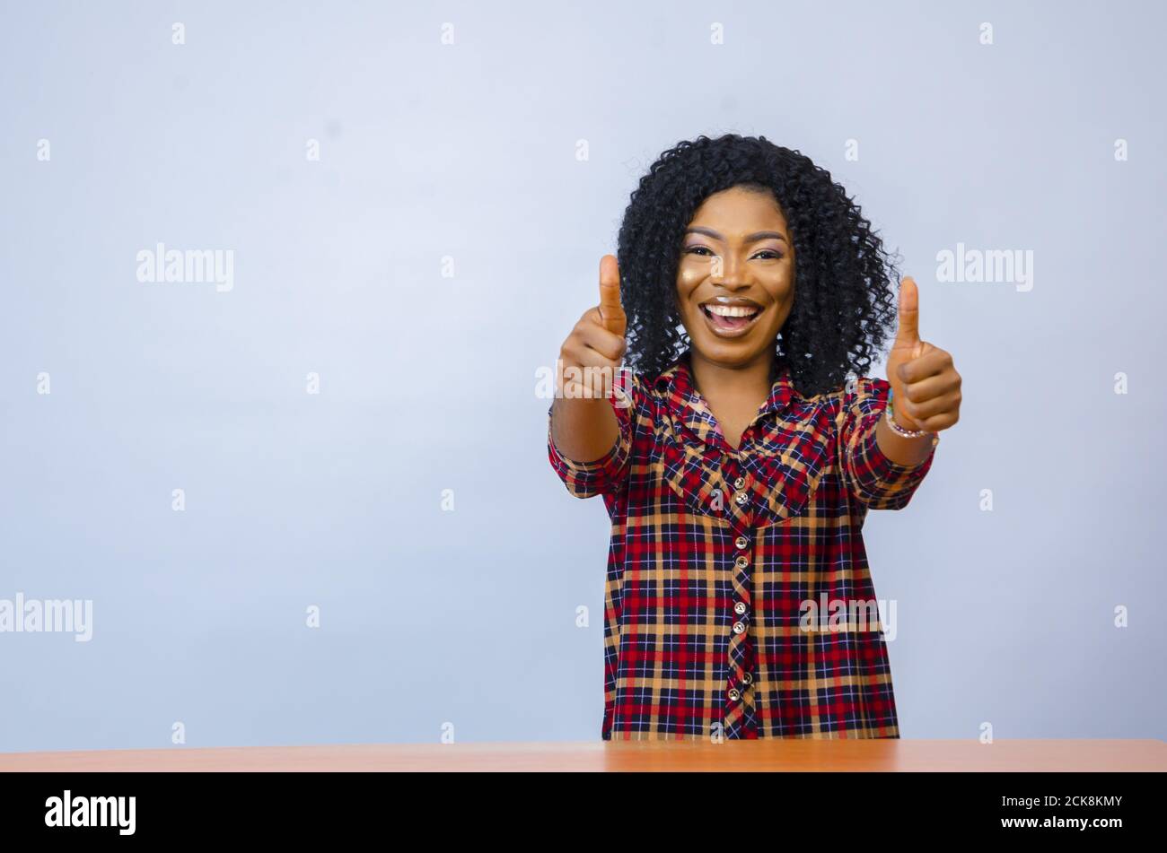 Thumbs up excited young african hi-res stock photography and images - Alamy