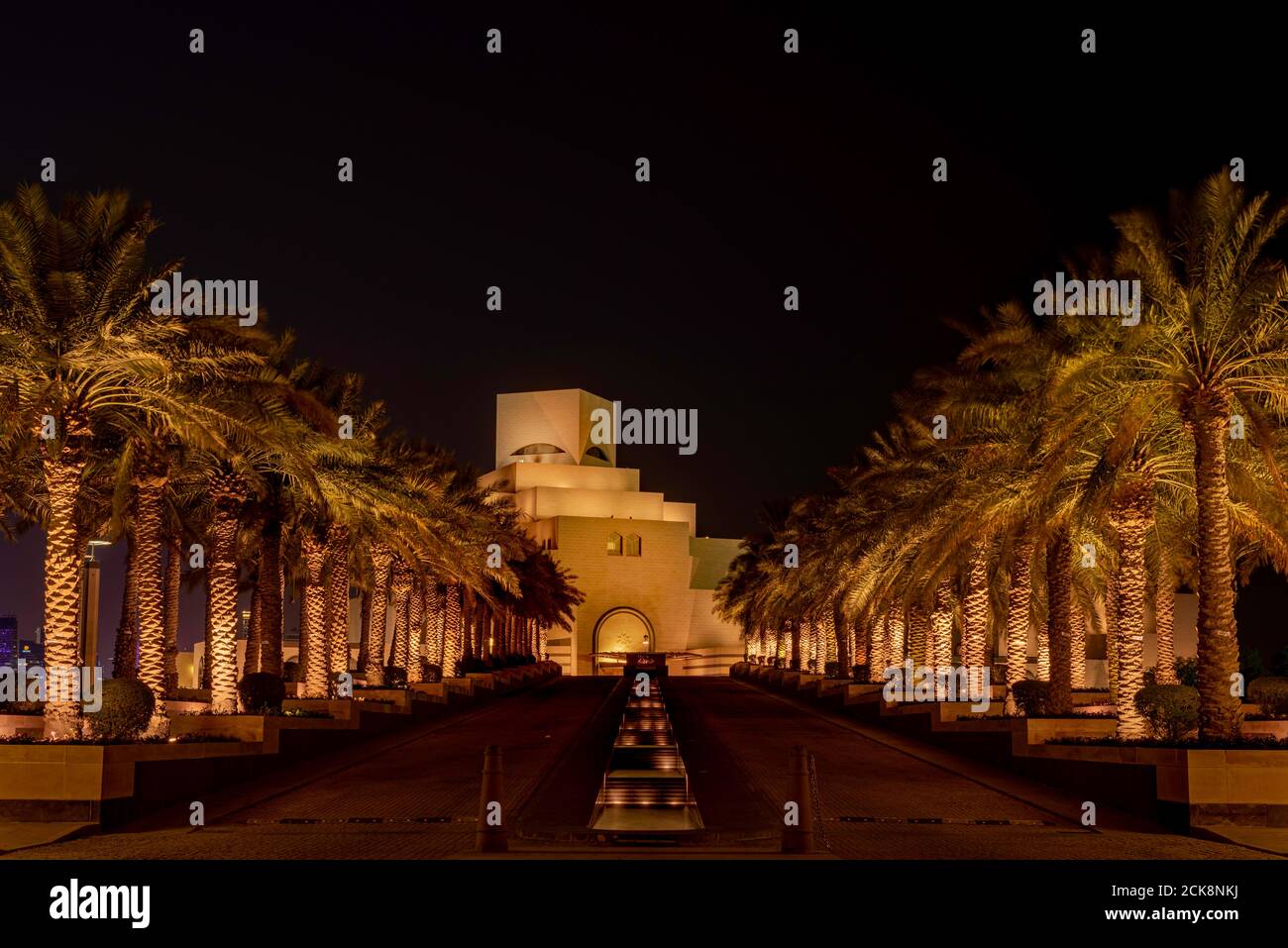 Doha, Qatar - August 26, 2020: Night view of Qatar city landmark, Museum of Islamic Art (MIA), showcasing modern Arabian architecture and construction Stock Photo