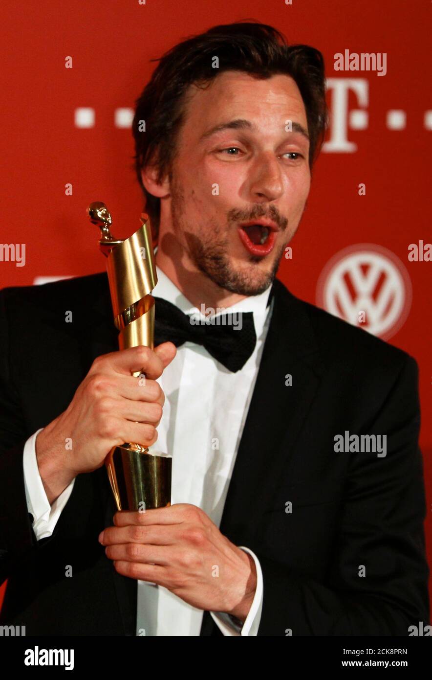 German actor Florian David Fitz poses with the award for the best male role in the movie 'Vincent will meer' during the German Film Prize (Lola) ceremony in Berlin, April 8, 2011.             REUTERS/Thomas Peter (GERMANY  - Tags: ENTERTAINMENT SOCIETY) Stock Photo