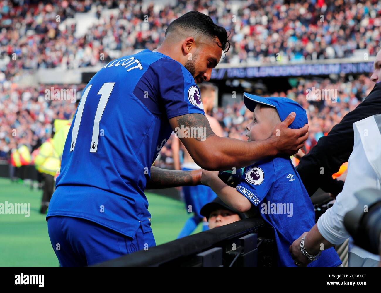 Soccer Football - Premier League - West Ham United vs Everton - London Stadium, London, Britain - May 13, 2018   Everton's Theo Walcott with a fan after the match   REUTERS/Eddie Keogh    EDITORIAL USE ONLY. No use with unauthorized audio, video, data, fixture lists, club/league logos or 'live' services. Online in-match use limited to 75 images, no video emulation. No use in betting, games or single club/league/player publications.  Please contact your account representative for further details. Stock Photo