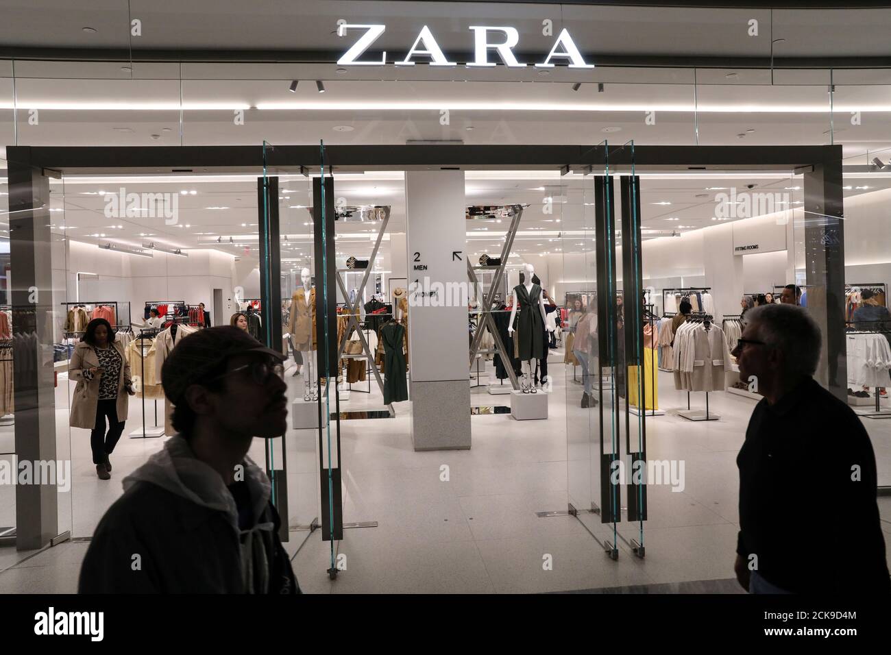 People shop at a Zara store during the grand opening of The Hudson Yards development, a residential, commercial, and retail space on Manhattan's West side in New York City, New York, U.S., March 15, 2019. REUTERS/Brendan McDermid Stock Photo