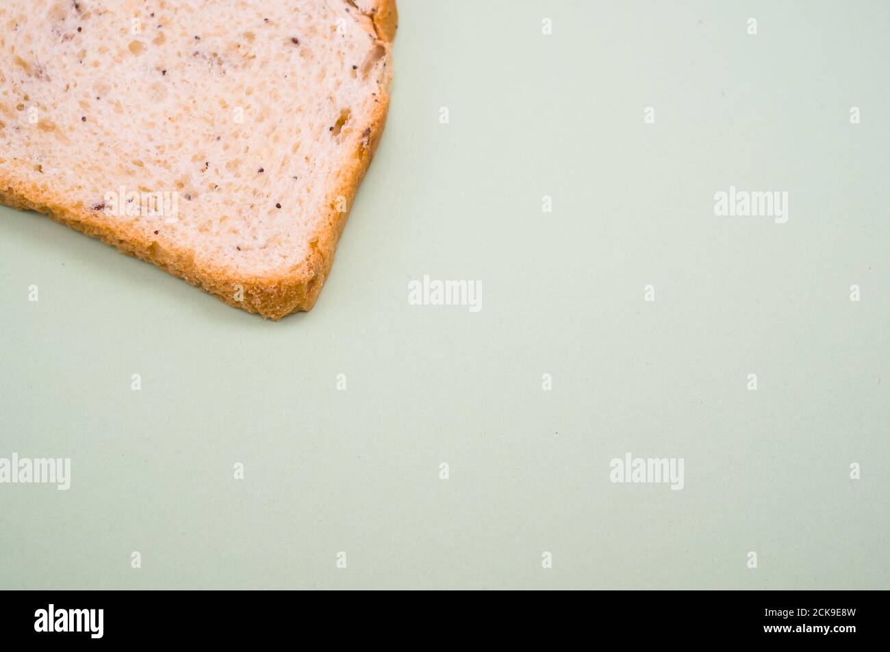 Slice of bread isolated on smooth gray background Stock Photo - Alamy