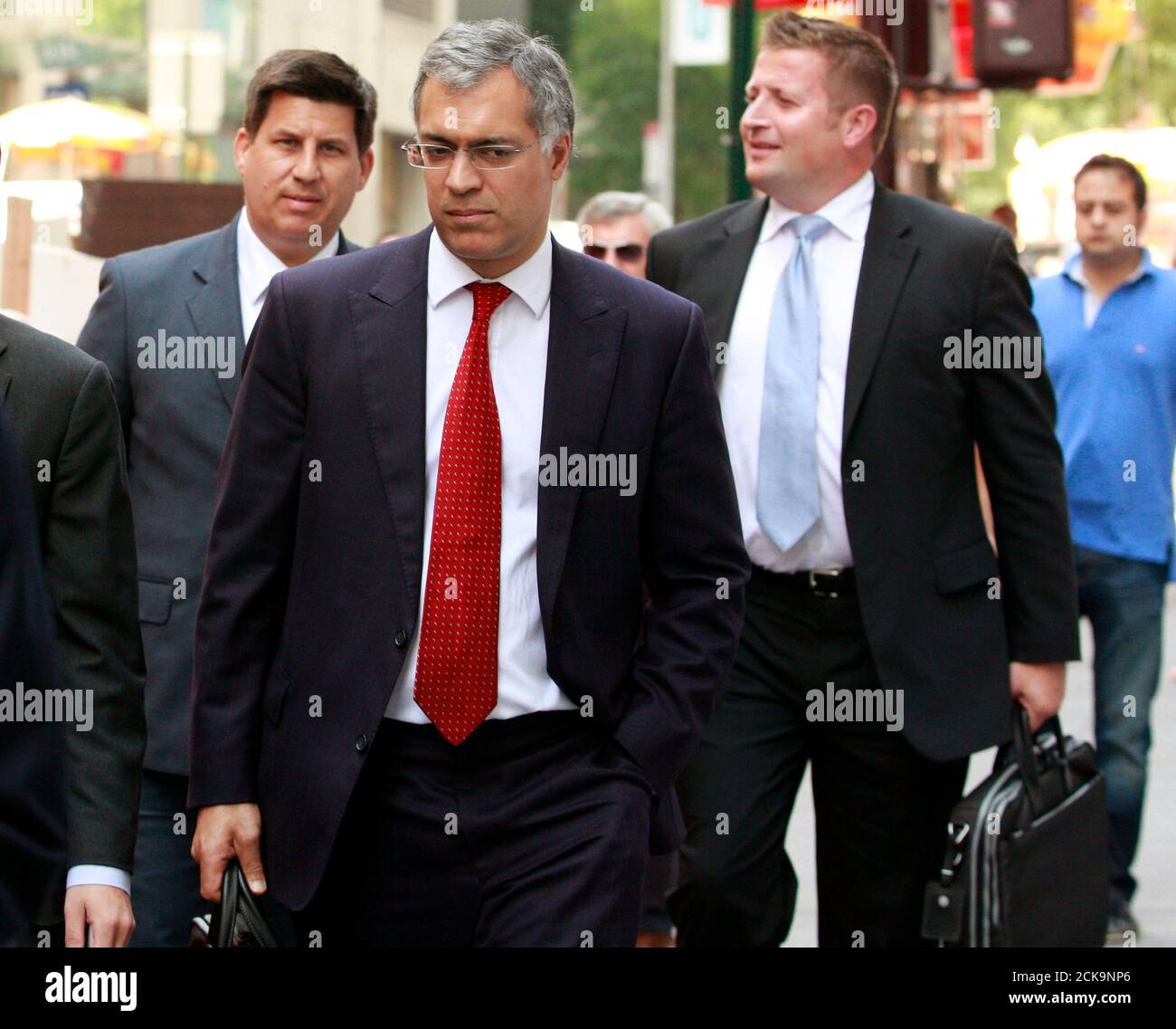 Manchester United Chief Operating Officer (COO) Michael Bolingbroke (C) walks with members of the Manchester United Ltd. IPO road show marketing team following their meetings with bankers in New York, August 6, 2012. Manchester United Ltd's owners stand to make about three times their investment in the British soccer club if it successfully goes public. REUTERS/Brendan McDermid (UNITED STATES  - Tags: BUSINESS SPORT SOCCER) Stock Photo