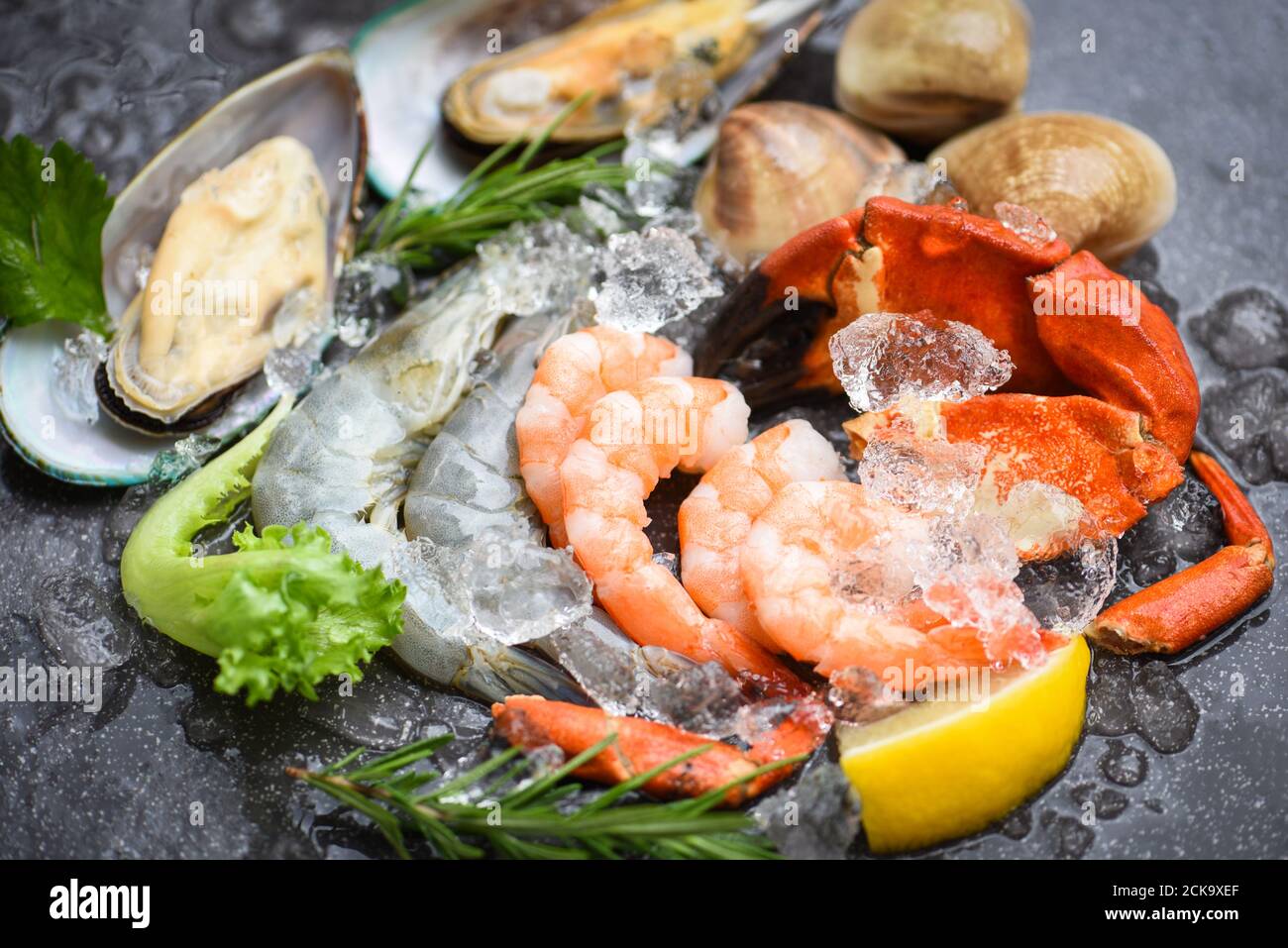 Fresh raw seafood buffet with lemon rosemary ingredients herb and
