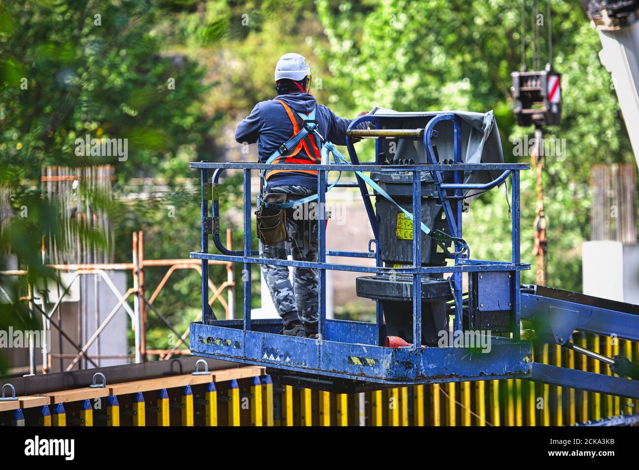 Man working on freight elevators on a construction site. Stock Photo