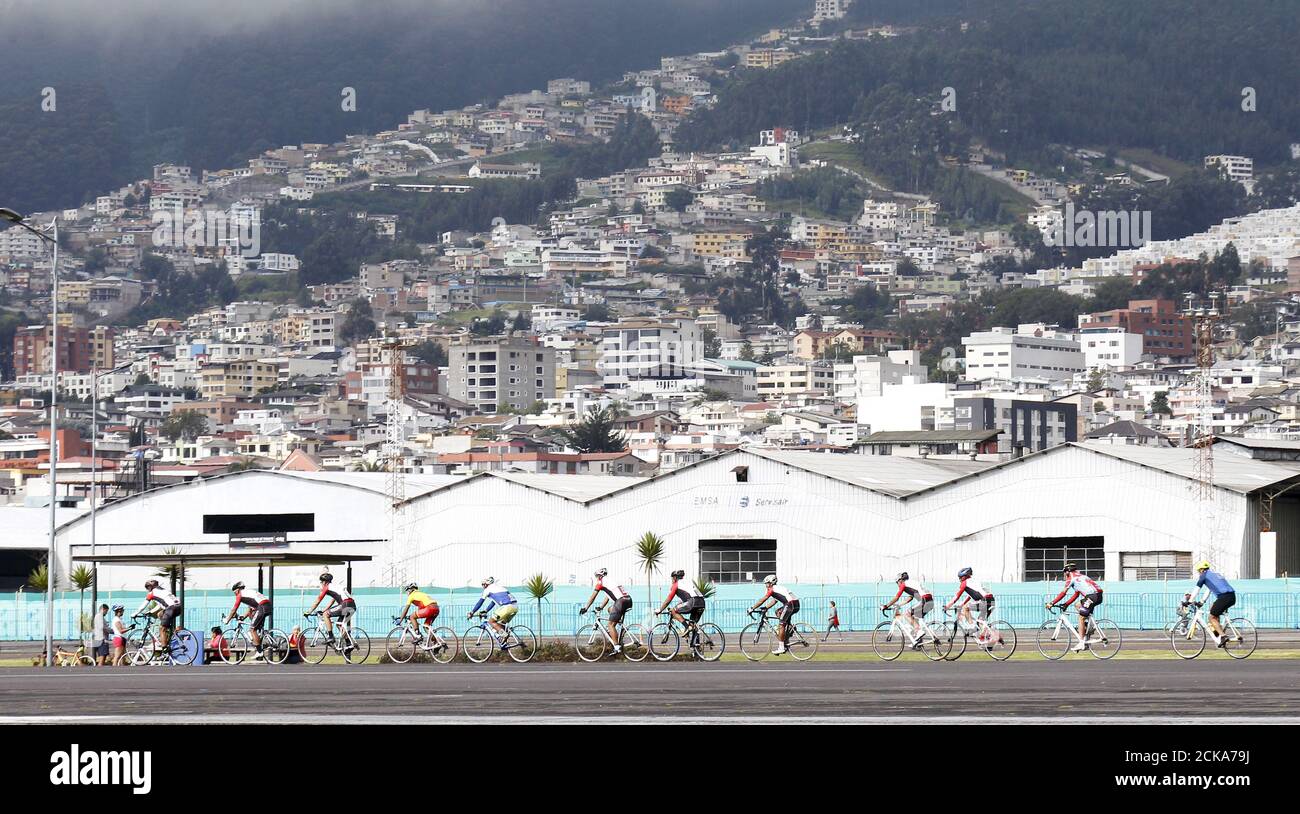 People cycle at the site of the former Quito airport, which was converted into a recreational area named Bicentenario park, in Quito March 6, 2016. REUTERS/Guillermo Granja Stock Photo