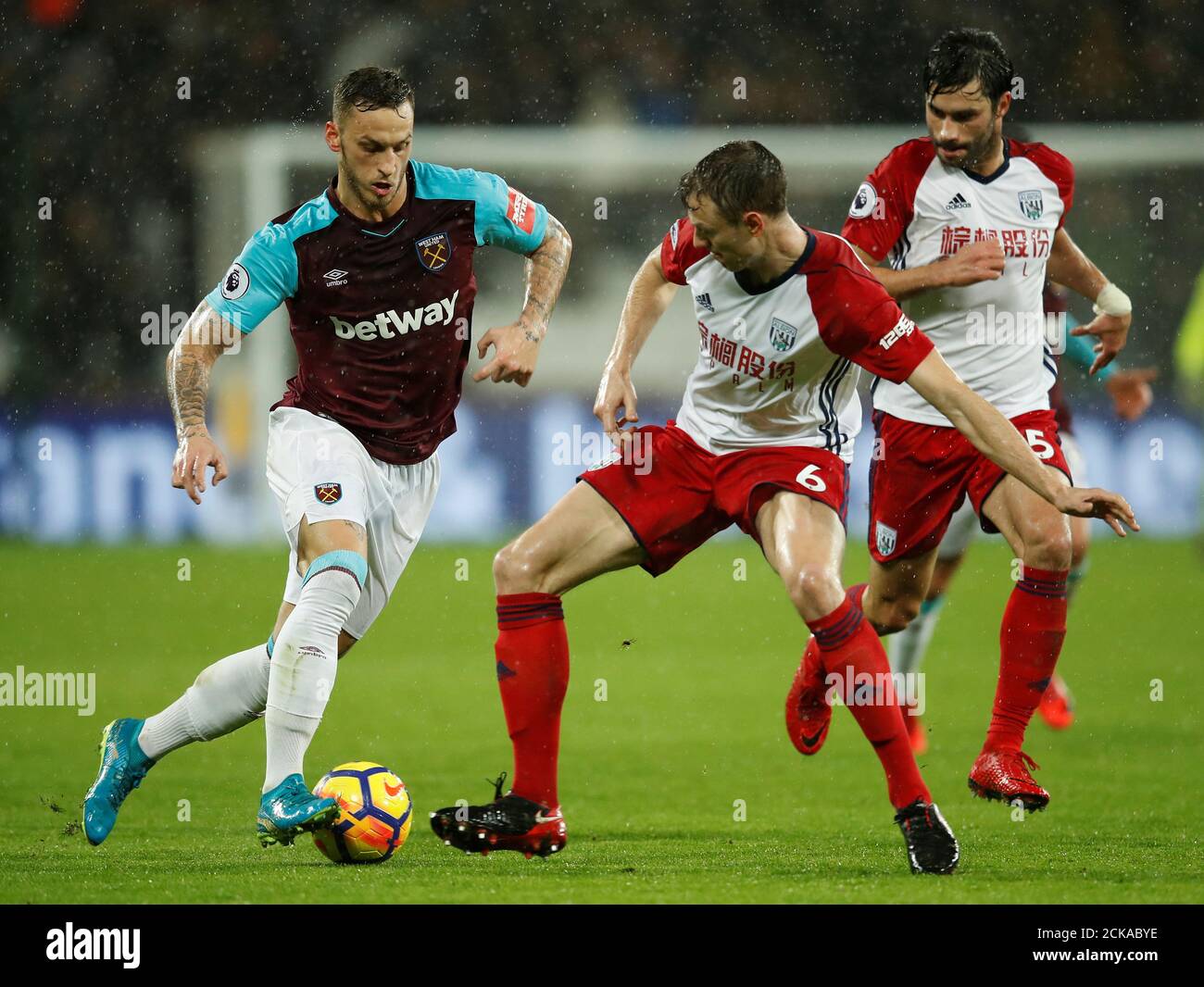Soccer Football - Premier League - West Ham United vs West Bromwich Albion - London Stadium, London, Britain - January 2, 2018   West Ham United's Marko Arnautovic in action with West Bromwich Albion's Jonny Evans   REUTERS/Eddie Keogh    EDITORIAL USE ONLY. No use with unauthorized audio, video, data, fixture lists, club/league logos or 'live' services. Online in-match use limited to 75 images, no video emulation. No use in betting, games or single club/league/player publications.  Please contact your account representative for further details. Stock Photo