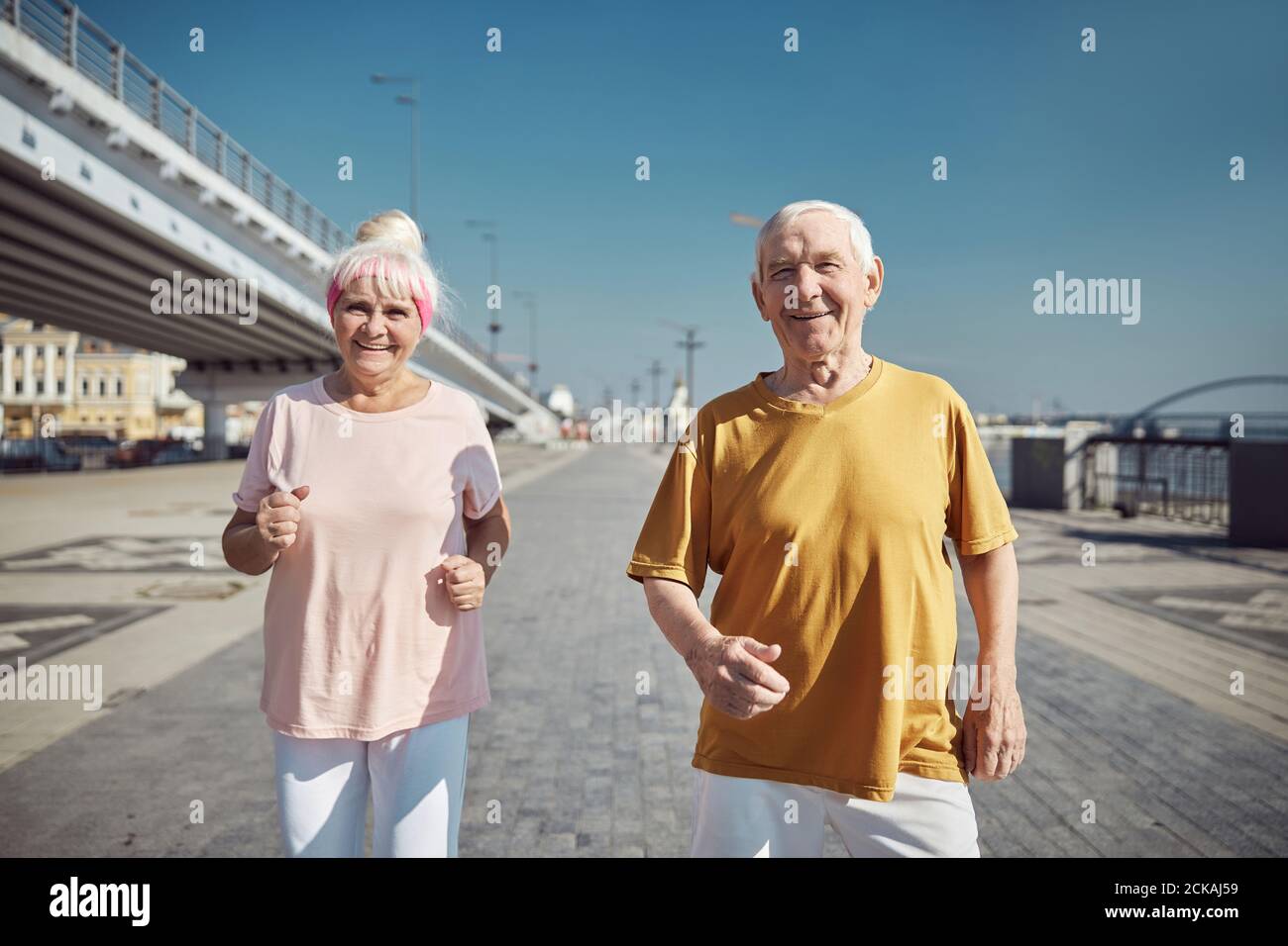 Man Holding A Yoga Mat Stock Photo Alamy