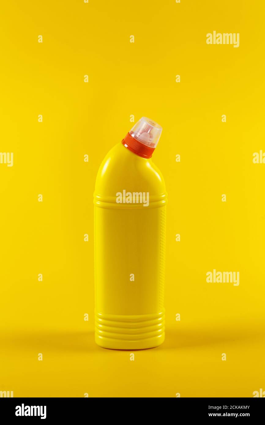 Bottle with detergent on a yellow background, space for text Stock Photo