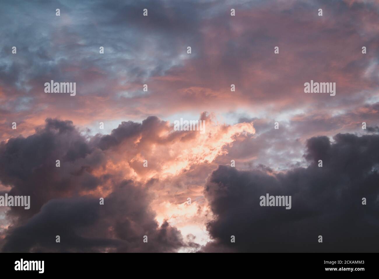 Beautiful view of the sunset sky with fluffy clouds Stock Photo - Alamy