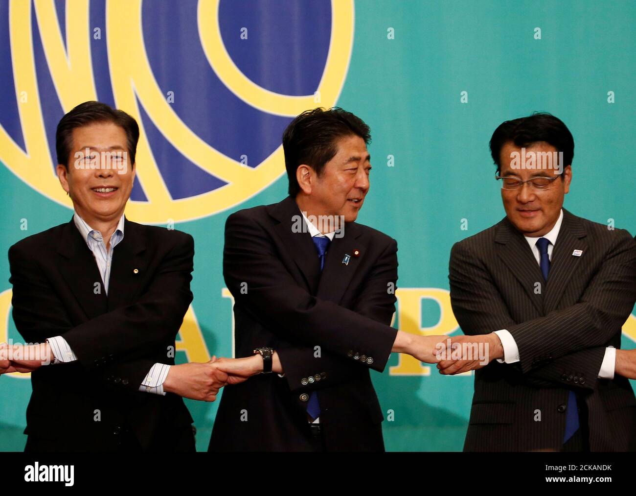 Japan S Prime Minister And Leader Of The Ruling Liberal Democratic Party Ldp Shinzo Abe C The Leader Of The Democratic Party Katsuya Okada R And Komeito Party Leader Natsuo Yamaguchi Attend A