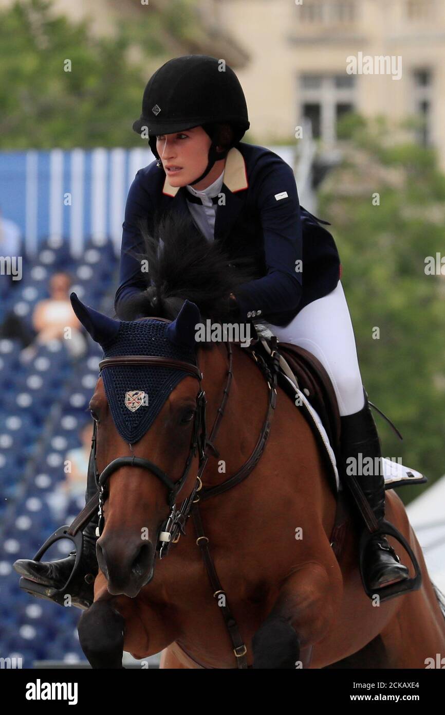 Jessica Springsteen of the U.S. riding RMF Zecile clears a hurdle in the Paris 1.45-meter jumping competition during the Longines Paris Eiffel Jumping 2018 Competition in Paris, France, July 5, 2018. REUTERS/Gonzalo Fuentes Stock Photo