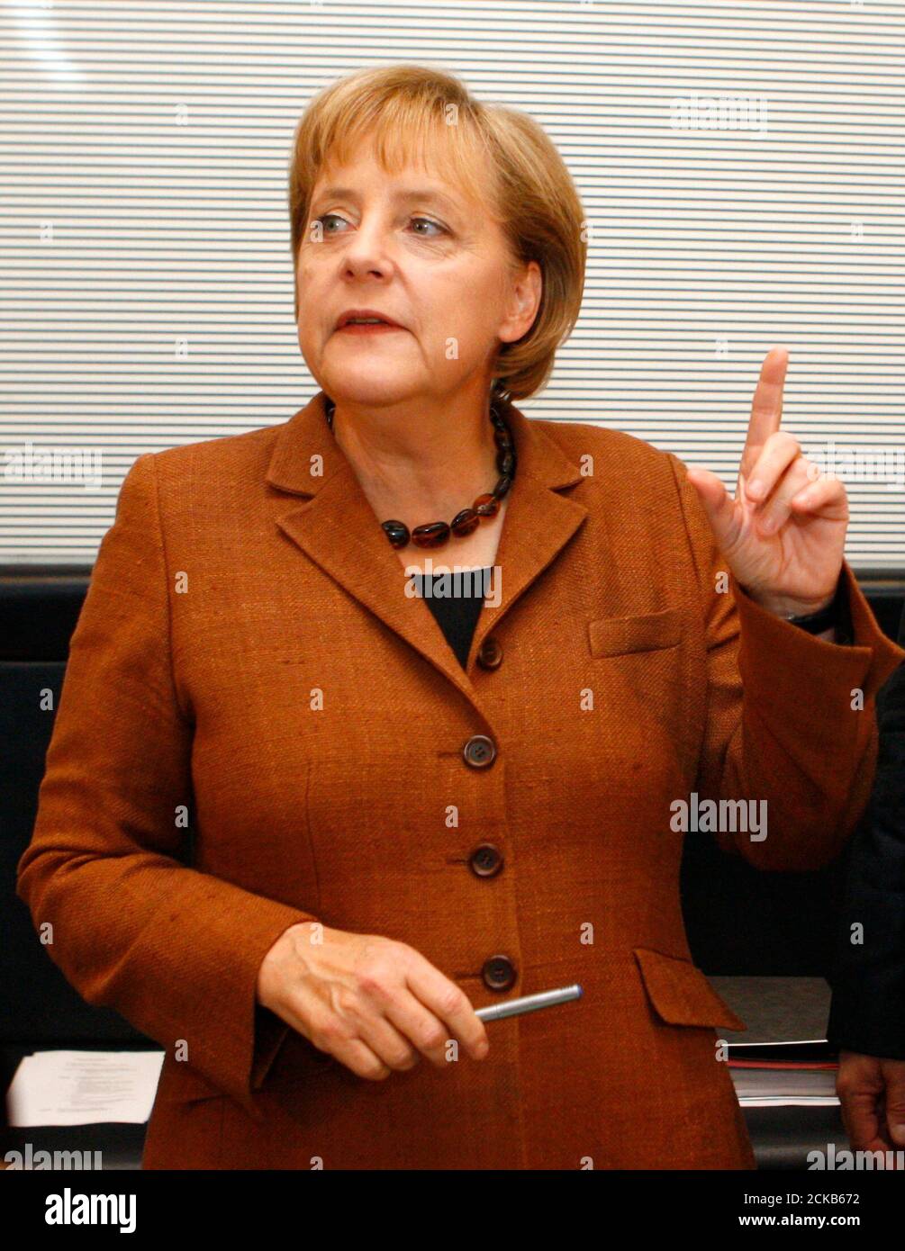 German Chancellor Angela Merkel and leader of the conservative Christian Democratic Union (CDU) is pictured before a meeting of the CDU parliamentary group in Berlin September 29, 2009.  REUTERS/Thomas Peter (GERMANY) Stock Photo