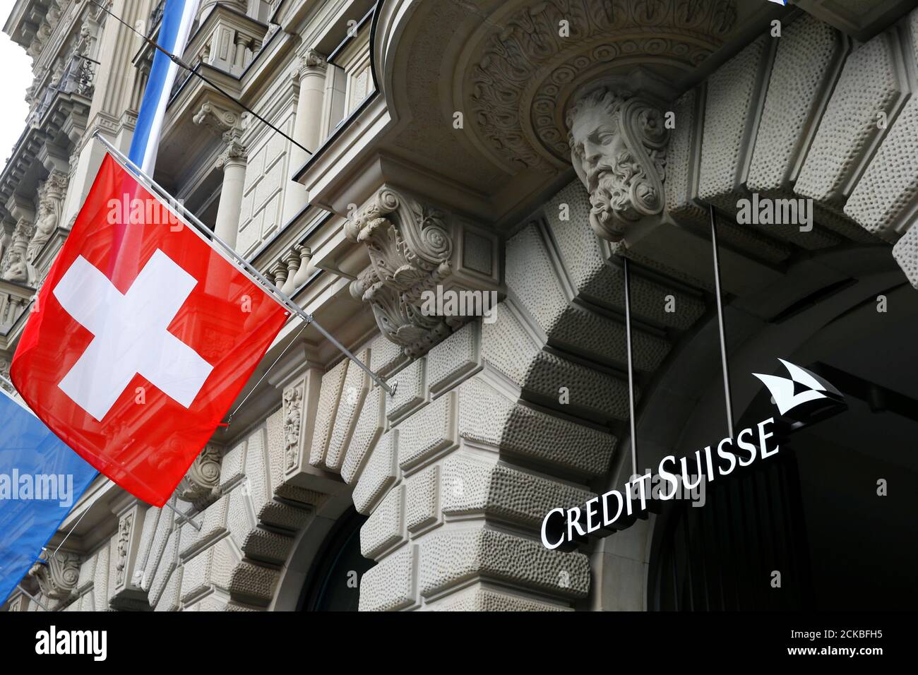 Switzerland S National Flag Flies Beside A Logo Of Swiss Bank Credit Suisse At Its Headquarters At The Paradeplatz Square In Zurich July 31 2019 Reuters Arnd Wiegmann Stock Photo Alamy