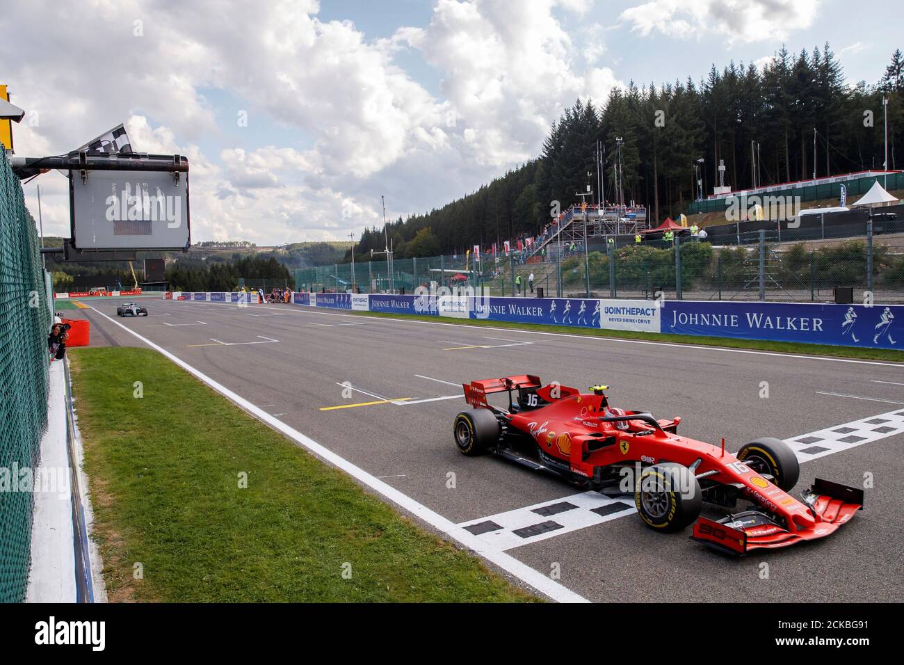 Formula One F1 - Belgian Grand Prix - Spa-Francorchamps, Stavelot, Belgium  - September 1, 2019 Ferrari's Charles Leclerc crosses the finish line to  win the race with Mercedes' Lewis Hamilton finishing second