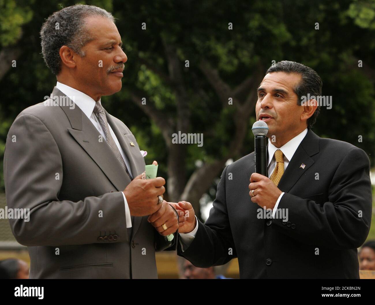 Los Angeles mayoral candidate Antonio Villaraigosa (R) gives a speech with Bernard C. Parks at a Cinco de Mayo student festival at Crenshaw High School, in Los Angeles, May 5, 2005. Parks is a city councilmember in South Los Angeles, a historically black neighborhood that is now 40 percent Latino. Villaraigosa will be the city's first Latino mayor in 133 years if he wins the runoff election May 17 against incumbent Mayor James Hahn. REUTERS/Lucy Nicholson  LN/HK Stock Photo
