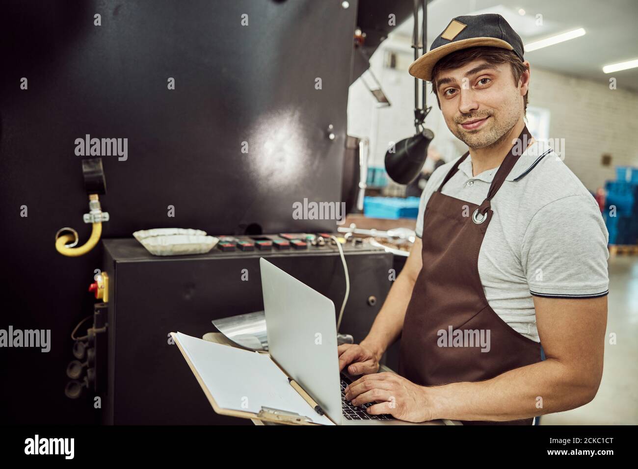 Male worker using modern laptop at work Stock Photo