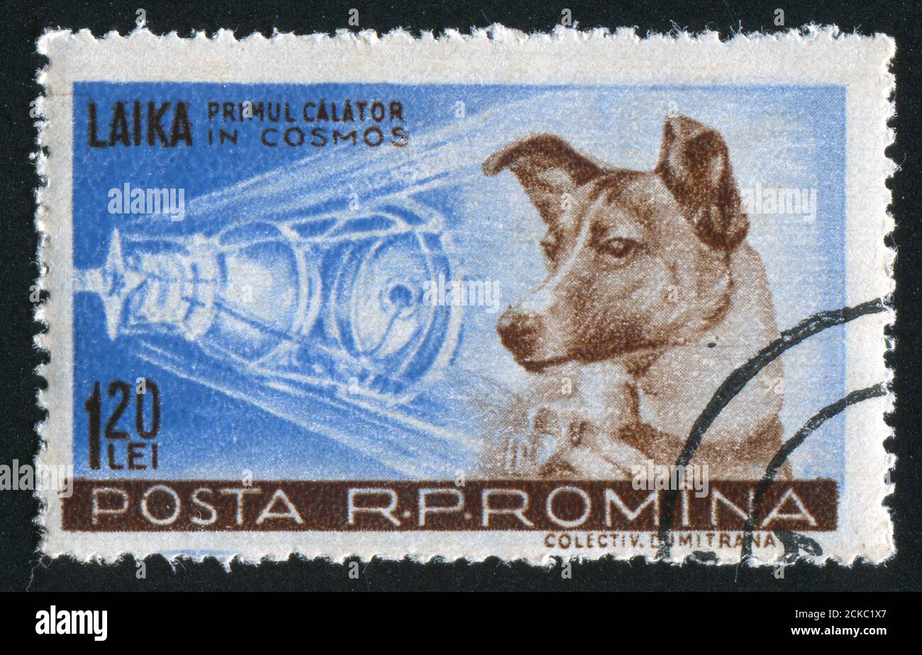 ROMANIA - CIRCA 1957: stamp printed by Romania, show Sputnik 2 and Laika, circa 1957. Stock Photo