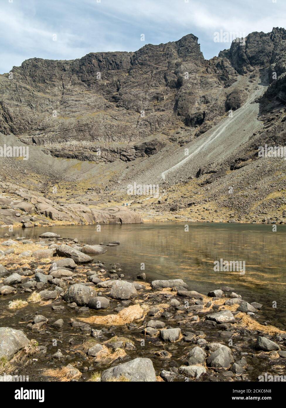 The small lake in the glaciated corrie of Coire Lagan in the Black Cuillin Mountains Skye, Scotland, UK Stock Photo
