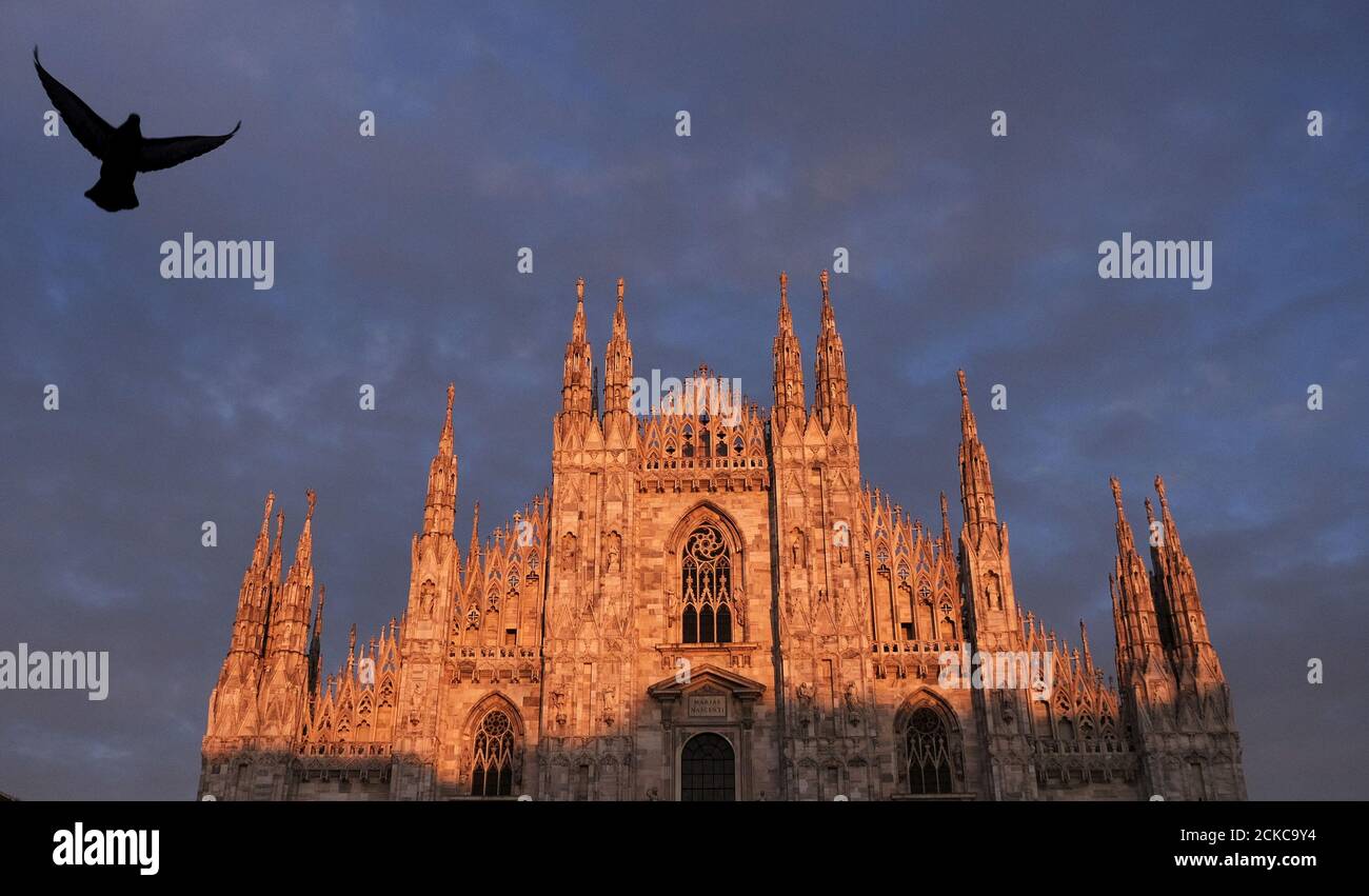 Duomo's Cathedral is pictured at sunset in downtown Milan, northern Italy February 25, 2015. The Milan Expo will open in the city on May 1, following the 2010 Shanghai Expo. Officials are counting on some 20 million visitors to the six month-long exhibition of products and technologies from around the world. Picture taken February 25, 2015.  REUTERS/Stefano Rellandini          TPX IMAGES OF THE DAY Stock Photo