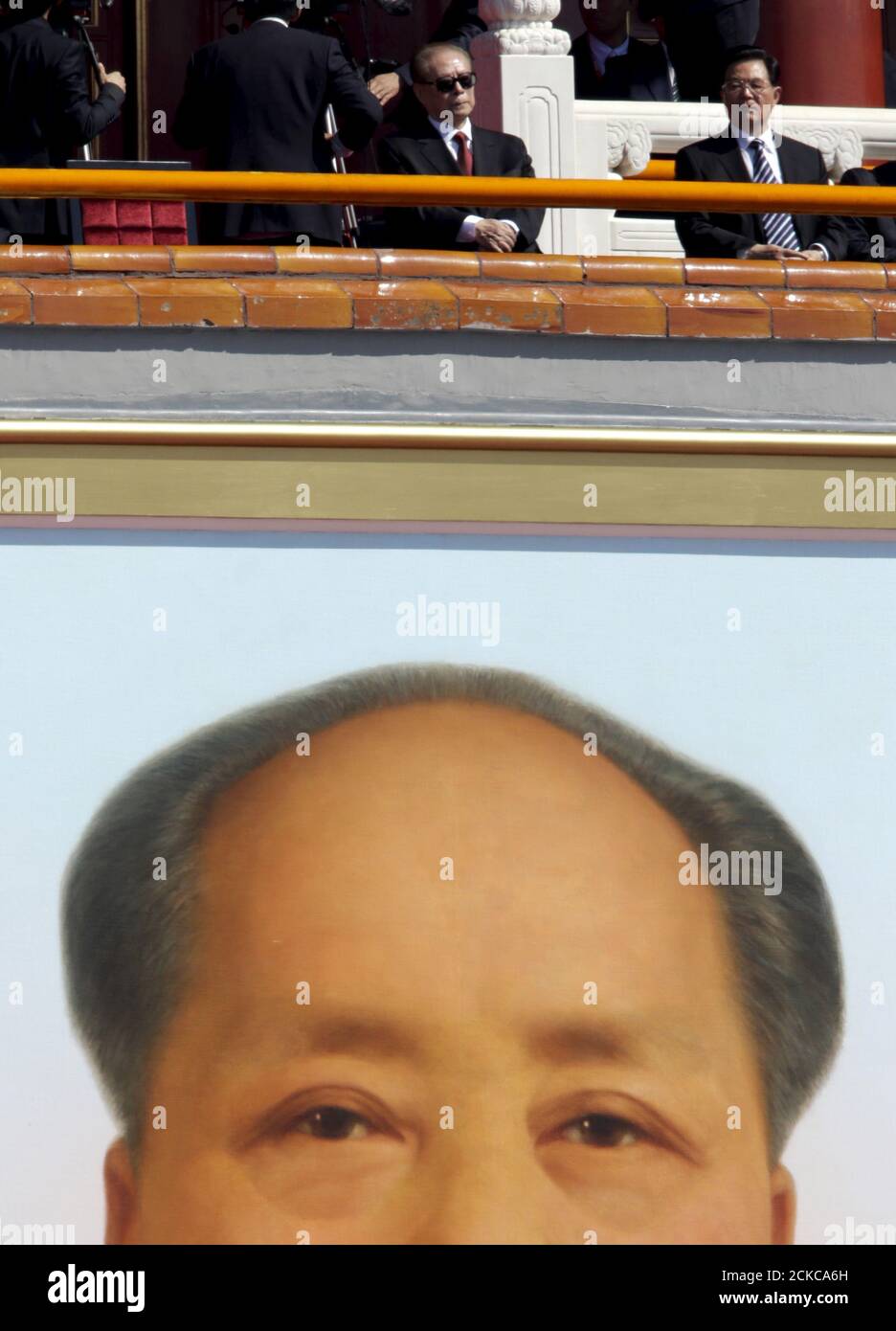 Former Chinese Presidents Jiang Zemin (L) and Hu Jintao are seen above of a portrait of late chairman Mao Zedong as they attend a military parade to mark the 70th anniversary of the end of World War Two, in Beijing, China, September 3, 2015.  REUTERS/Jason Lee Stock Photo