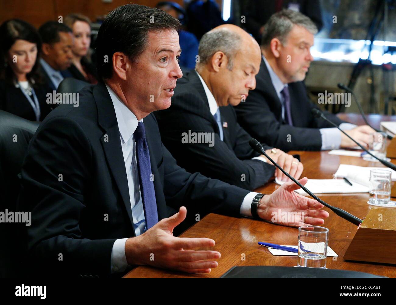 FBI Director James Comey Jr. (L) testifies on 'Threats to the Homeland' as Homeland Security Secretary Jeh Johnson (C) and Director of the National Counterterrorism Center Nicholas Rasmussen listen during a Senate Homeland Security and Governmental Affairs Committee hearing on Capitol Hill in Washington, October 8, 2015. REUTERS/Jim Bourg Stock Photo