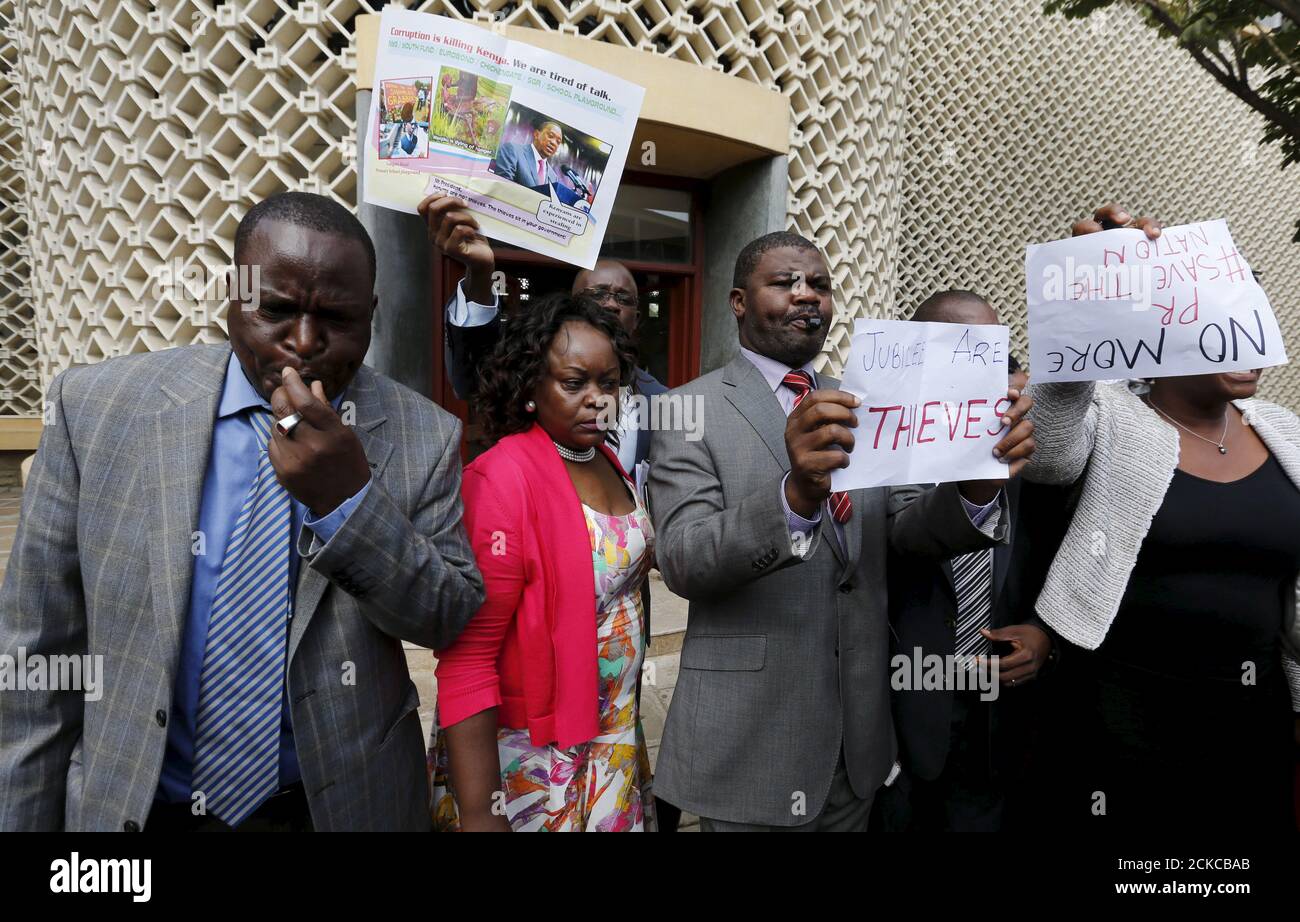 Kenyan opposition Members of Parliament blow whistles and hold placards in protest as they leave the National Assembly during President Uhuru Kenyatta's annual State of the Nation address at the Parliament Buildings in the capital Nairobi, March 31, 2016. REUTERS/Thomas Mukoyaâ€¨â€¨ Stock Photo