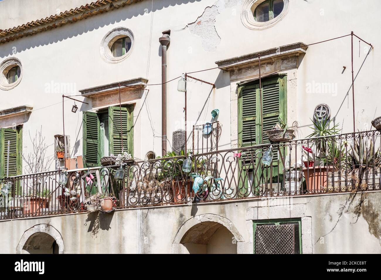Pretty green Mediterranean shutters in Ortygia - Sicily, Italy Stock Photo