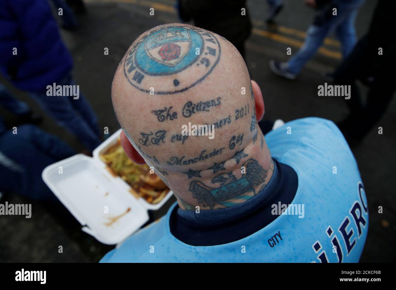 Soccer Football - Premier League - Manchester City v Arsenal - Etihad Stadium, Manchester, Britain - February 3, 2019 A Manchester City fan with a Manchester City tattoo on his head outside Soccer Football - Premier League - Manchester City v Arsenal - Etihad Stadium, Manchester, Britain - February 3, 2019 A Manchester City fan with a Manchester City tattoo on his head outside