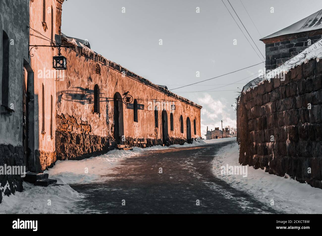 Wonder winter view of the medieval cobbled street in the Vyborg castle. Stock Photo