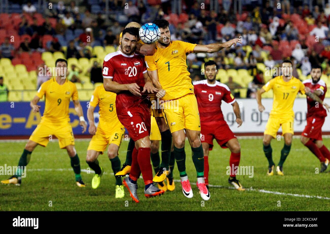 Football Soccer - Syria v Australia - 2018 World Cup Qualifying Asia Zone  Playoffs - Hang Jebat Stadium, Melaka, Malaysia - October 5, 2017.  Australia's Mathew Leckie and Syria's Khaled Al Mbayed