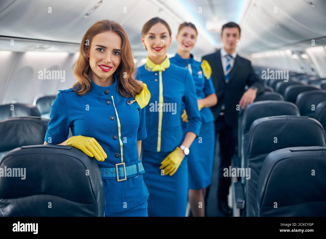Attractive female airline pilot standing hi-res stock photography and ...