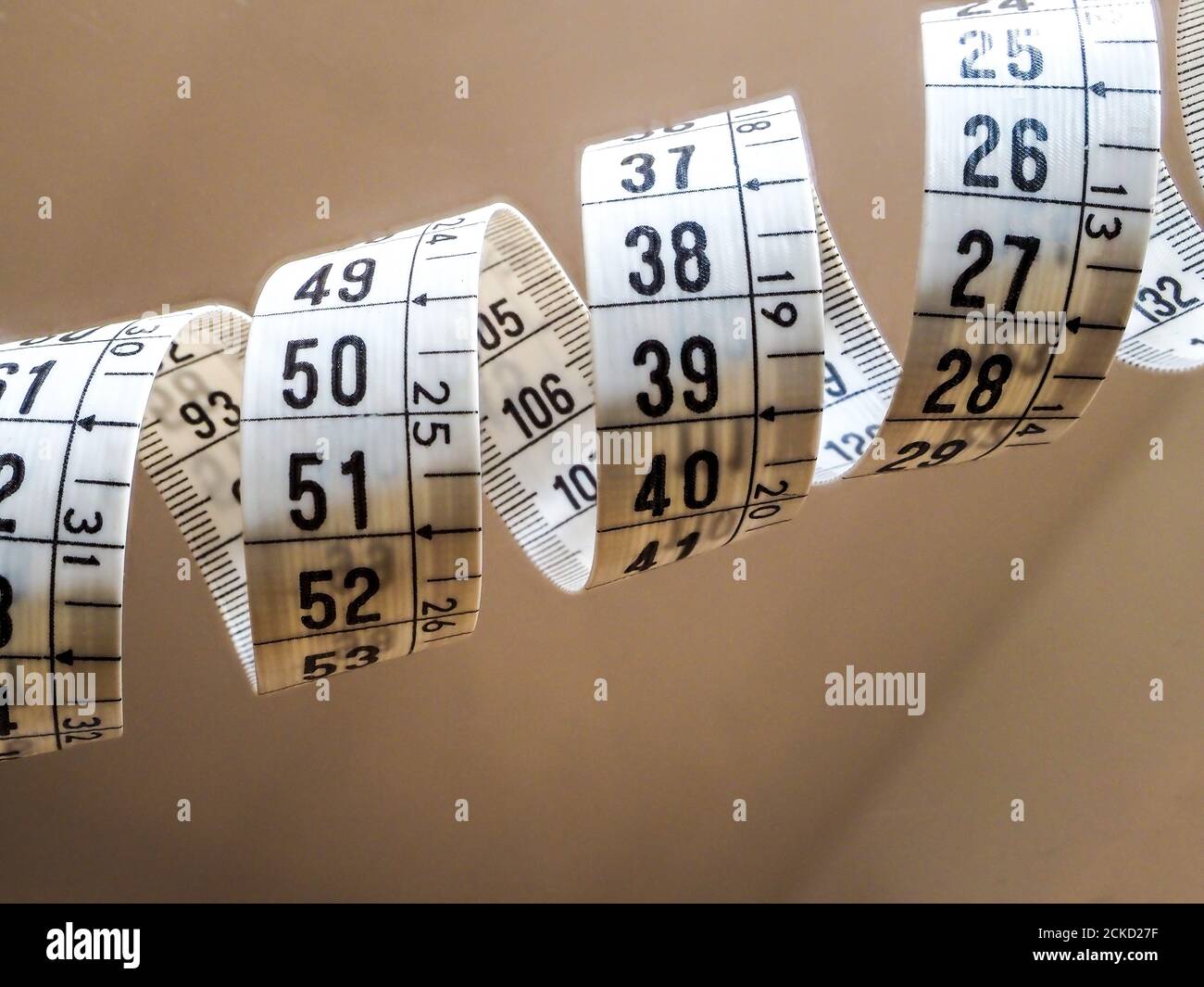 Tape measure, used by dressmakers and tailors to take measurements of the clothes to be made