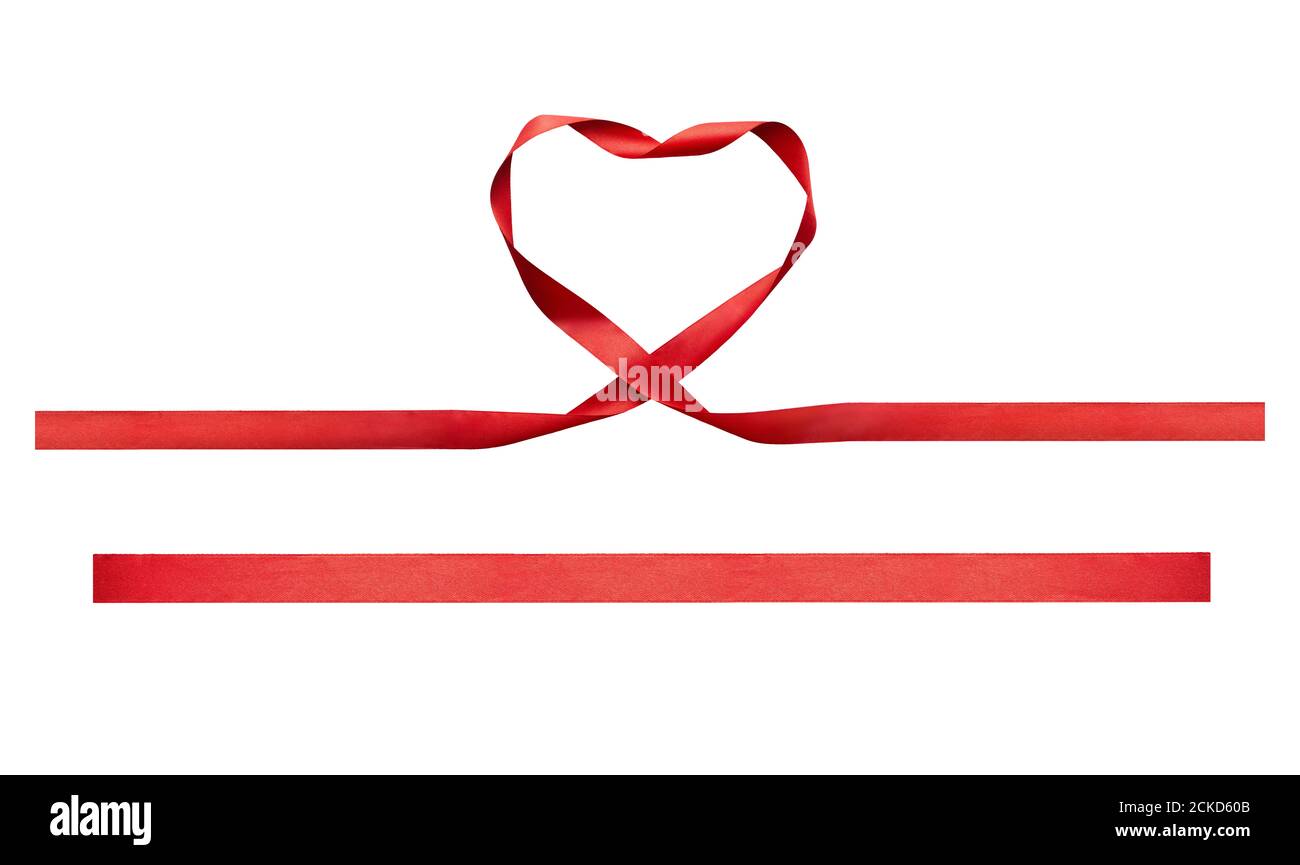 A curly heart shape red ribbon for Christmas and birthday banner isolated against a white background. Stock Photo