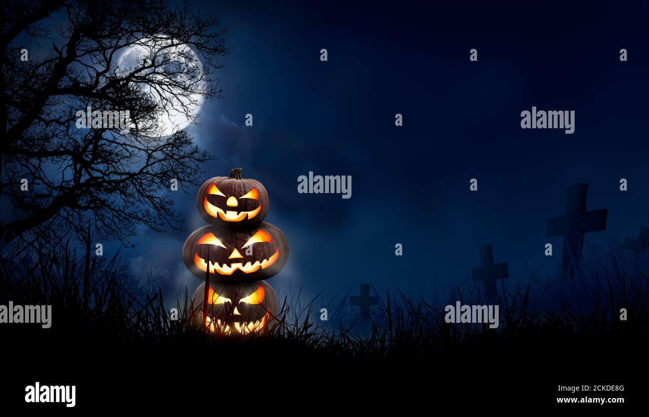 A stack of 3 spooky halloween pumpkin, Jack O Lantern, with an evil ...