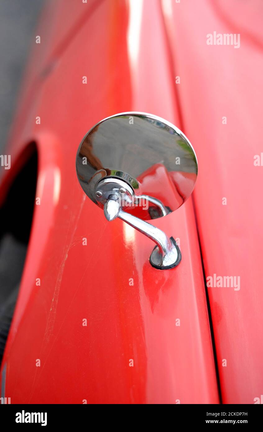 round, circular chromium plated wing mirror on vintage rover car, norfolk, england Stock Photo