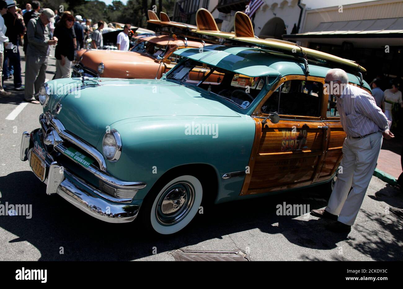 A 1950 Ford Country Squire Station Wagon is displayed during the Carmel-by-the-Sea Concours on the Avenue car show in Carmel, California, August 12, 2014. The event is held in conjunction with the Pebble Beach Concours d'Elegance. REUTERS/Michael Fiala (UNITED STATES - Tags: SOCIETY TRANSPORT) Stock Photo