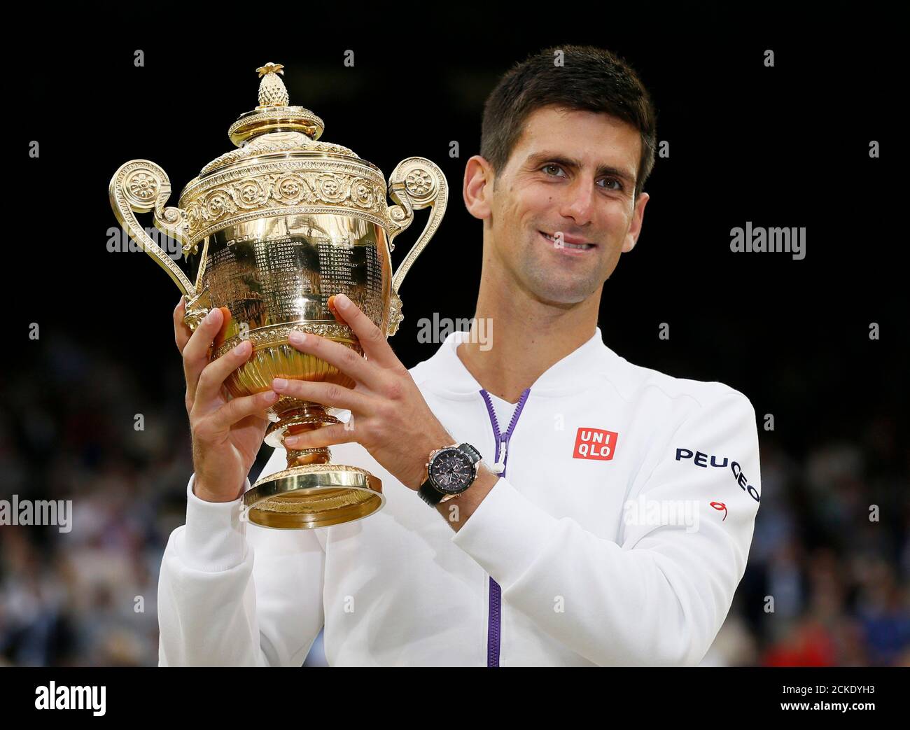 Novak Djokovic Of Serbia Shows Off The Trophy After Winning His Men S Singles Final Match Against Roger Federer Of Switzerland At The Wimbledon Tennis Championships In London July 12 15 Reuters Stefan Wermuth