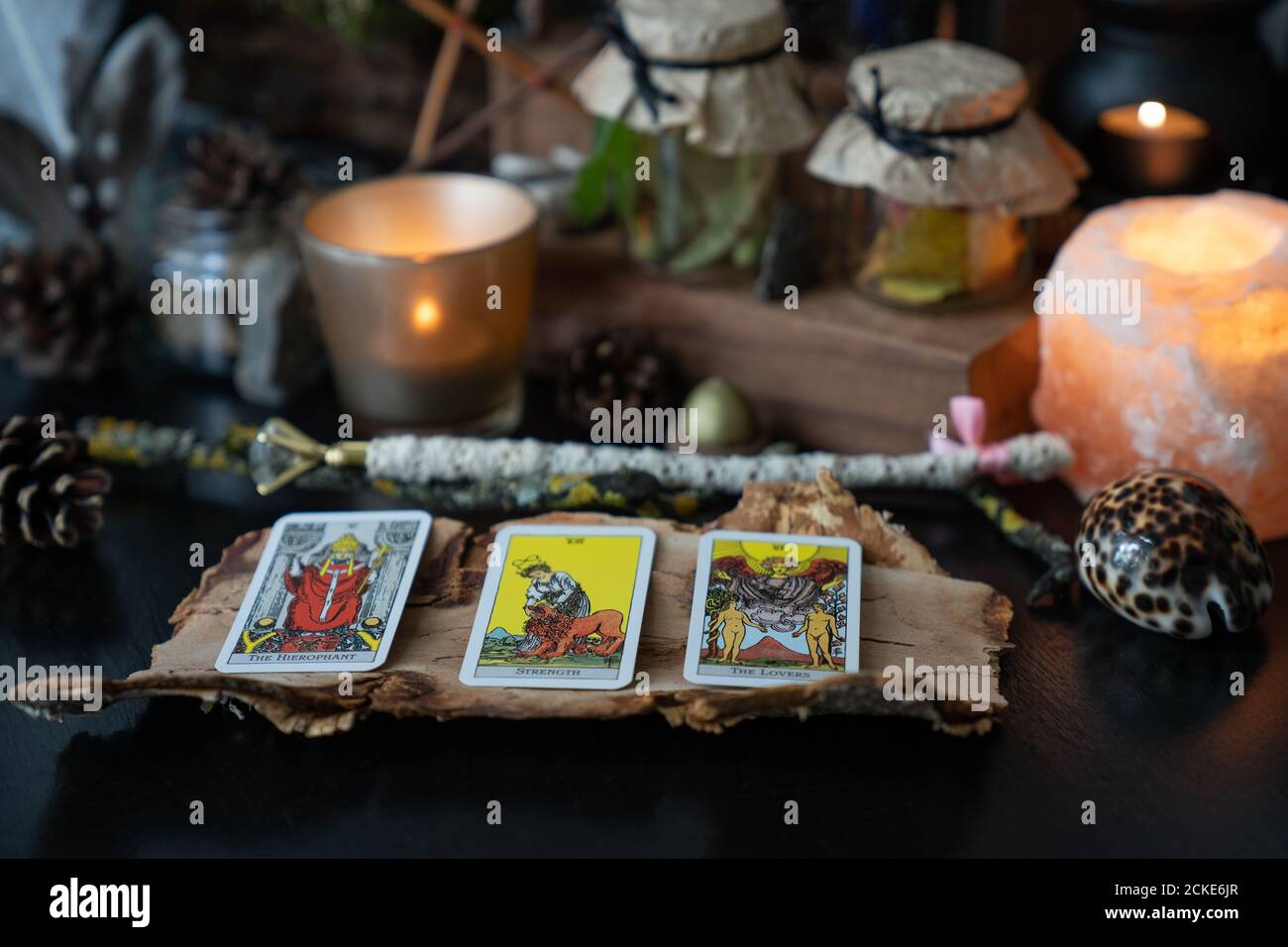 Elva/Estonia - 31 August 2020 - 3 Tarot Rider Waite cards spread lying on a black table with magic items. Stock Photo