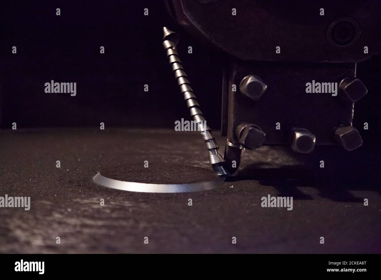 Spiral metal facing of lathe tool on turning machine. Closeup photo