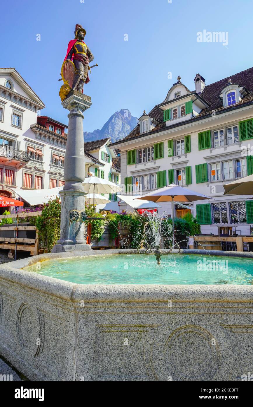 Fountain (Brunnen-Mandl)  in the central plaza in Schwyz. The medieval town  Schwyz is the capital of the canton of Schwyz in Switzerland. The Federal Stock Photo