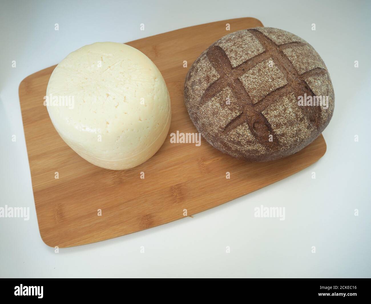The cheese is a round head with bread. Stock Photo